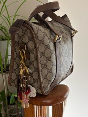Authentic Gucci Beige Brown Monogram Barrel Bag with Floral Charm